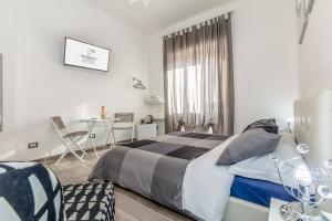 Postel nebo postele na pokoji v ubytování Scirocco Rooms