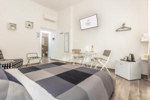 Postel nebo postele na pokoji v ubytování Scirocco Rooms