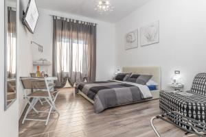 Postel nebo postele na pokoji v ubytování Scirocco Rooms