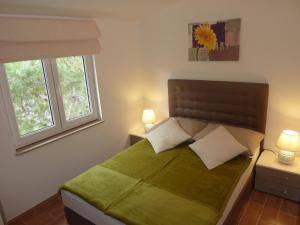 Postel nebo postele na pokoji v ubytování Apartments Ori
