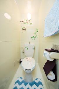 a bathroom with a toilet and a sink at Cozy house K46, free wifi a rented electric bicycle in Kyoto