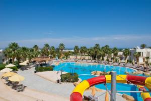 a pool at a resort with a water slide at Amphoras Aqua Adults Friendly in Sharm El Sheikh