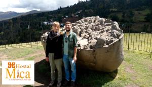 a man and a woman standing in front of a statue at Hostal Mica in Abancay