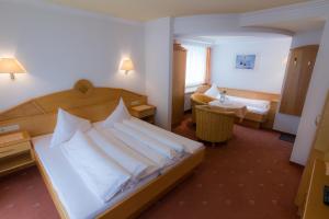 Posteľ alebo postele v izbe v ubytovaní Hotel Garni Martina