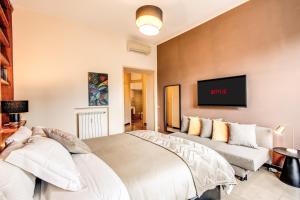 מיטה או מיטות בחדר ב-Borghese Green