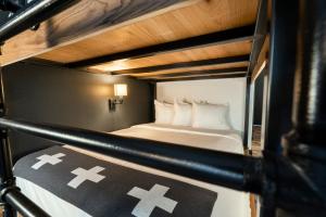 a two level bunk bed with crosses on it at Gravity Haus in Breckenridge