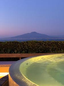 a large bath tub with a view of the ocean at Grand Hotel Aminta in Sorrento