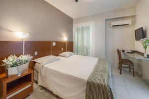 Un ou plusieurs lits dans un hébergement de l'établissement Hotel GAPH Maringa - Economico Mini Resort