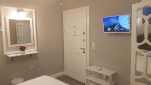 a room with a white door and a white stool at Little Palace Blue Apartment in Istanbul +154 photos