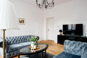 Televízia a/alebo spoločenská miestnosť v ubytovaní Apartament Nowe Miasto - Skwer Malarzy