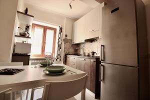 Kuchyň nebo kuchyňský kout v ubytování Sei Unica