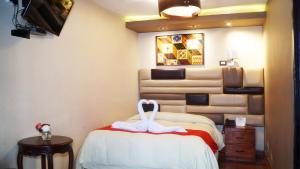 Katil atau katil-katil dalam bilik di Hotel Royal Qosqo