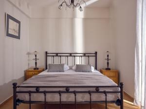 Ένα ή περισσότερα κρεβάτια σε δωμάτιο στο Three Graces Holiday Houses Complex