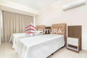 two beds in a hotel room with the word future at LA018E - Apartamento na Praia in Bombinhas