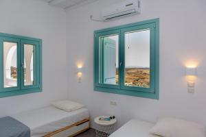 เตียงในห้องที่ Azaland Naxos