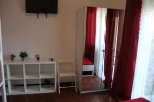 a room with a mirror and a table and a bed at Domus Vatican Holiday's in Rome