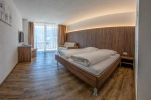 Postel nebo postele na pokoji v ubytování Gasthof Falkenstein