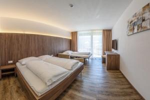 Postel nebo postele na pokoji v ubytování Gasthof Falkenstein