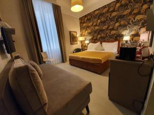 Postel nebo postele na pokoji v ubytování Hotel Maxim Axial