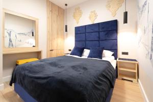 Posteľ alebo postele v izbe v ubytovaní Apartamenty Marron z sauną, bawialnią i widokiem na Skrzyczne - Dream Apart