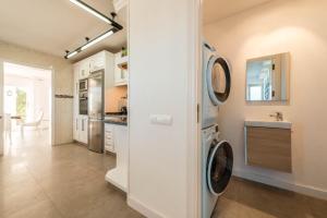 A kitchen or kitchenette at Villa Views Can Funtasa II