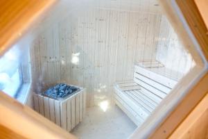 an overhead view of a sauna with a tub at Haus Alpengluehn in Iselsberg