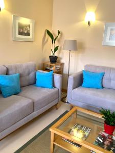 a living room with two couches and a coffee table at Hotel Central in Valdepeñas