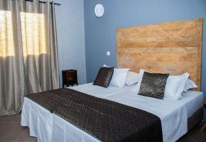 Postel nebo postele na pokoji v ubytování Aparthotel Palace