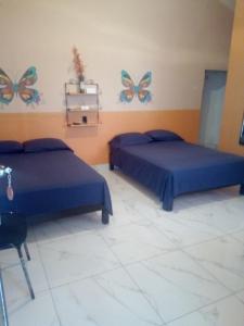 Postel nebo postele na pokoji v ubytování Casa Santuario Hotel Boutique