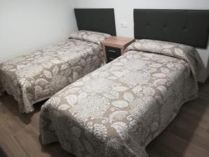 Posteľ alebo postele v izbe v ubytovaní Apartamentos Buena Vista Bajo 1