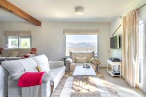 a living room with a couch and a table at La "Casita" de la Sierra in Guadarrama