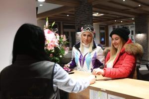 a group of three women standing around a counter at Župa Wellness & Spa in Kopaonik