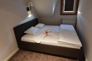 Una cama o camas en una habitación de Župa Wellness & Spa