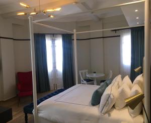Postel nebo postele na pokoji v ubytování Hotel Conde de Penalba