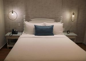 Postel nebo postele na pokoji v ubytování Hotel Conde de Penalba