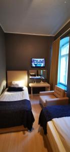 Postel nebo postele na pokoji v ubytování Sundsvall City Hotel + 37 fotografií