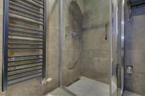 a shower with a glass door in a bathroom at Apartment A17 LUX in Jahorina +18 photos