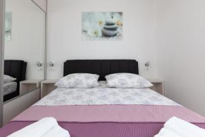 Postel nebo postele na pokoji v ubytování Top floor Apartment Neyla