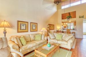 a living room with two couches and a table at Keauhou Kona Surf & Racquet Club #7-302 in Kailua-Kona