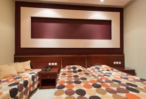 Postel nebo postele na pokoji v ubytování Canadian Hotel