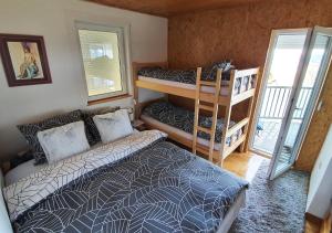 Postel nebo postele na pokoji v ubytování Apartments Panda