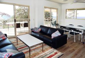 a living room with a couch and a table at At Cylinder Unit 3 in Point Lookout