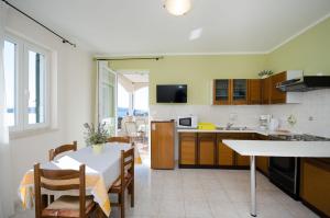 A kitchen or kitchenette at Apartments Erika