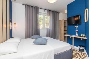 Posteľ alebo postele v izbe v ubytovaní Apartment 4 Olives