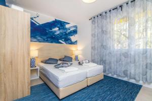 Posteľ alebo postele v izbe v ubytovaní Apartment 4 Olives