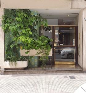 a window of a building with plants in it at Monoambiente Centro ESTRATÉGICA UBICACIÓN in Buenos Aires