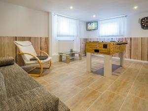 TV a/nebo společenská místnost v ubytování Ferienhaus Gretel in Zorge