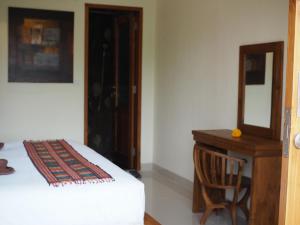 Kampung Sari Homestay客房内的一张或多张床位
