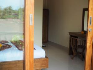 Kampung Sari Homestay客房内的一张或多张床位