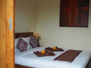Kampung Sari Homestay客房内的一张或多张床位